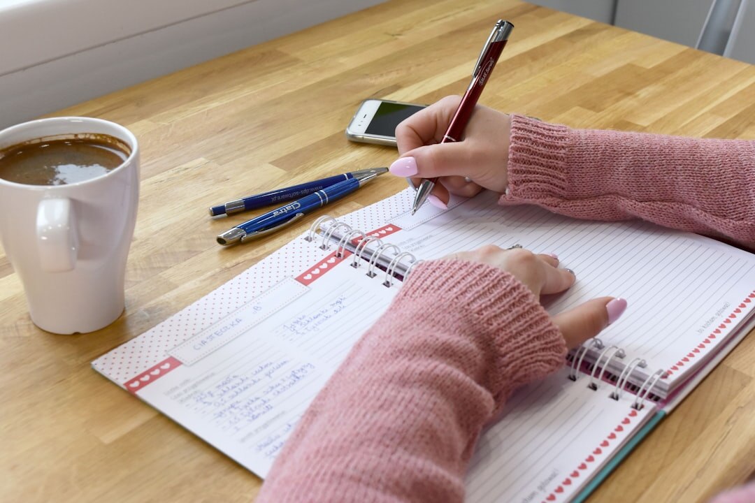 person journaling at desk