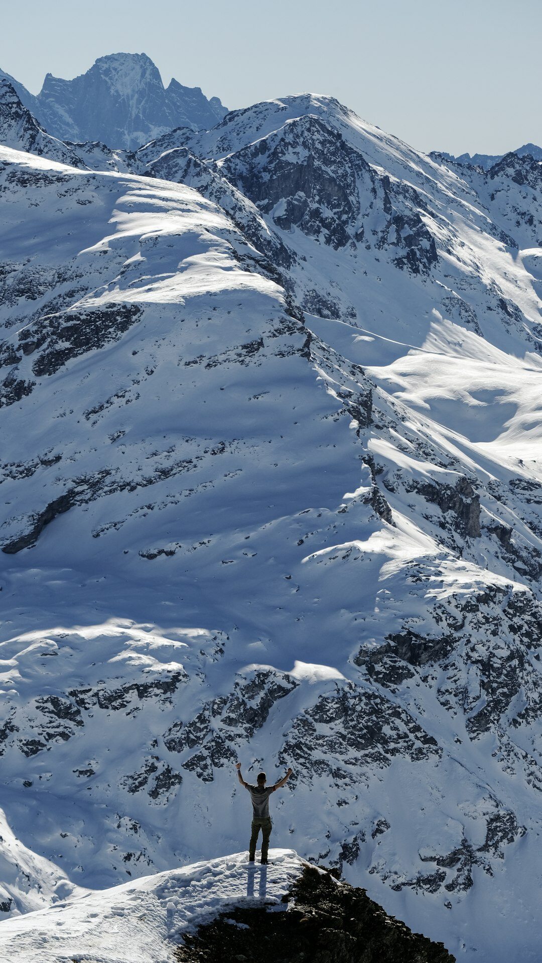 person achieving goal on mountain