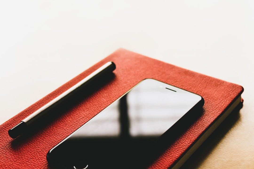 Open notebook with pen on a wooden desk in warm light